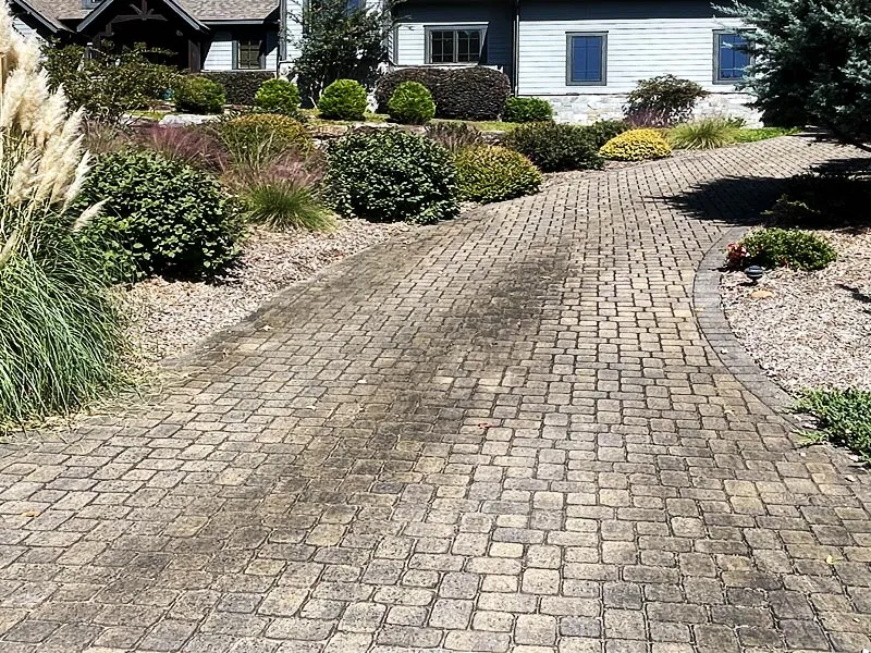 Faded and damaged pavers showing weathering and stains